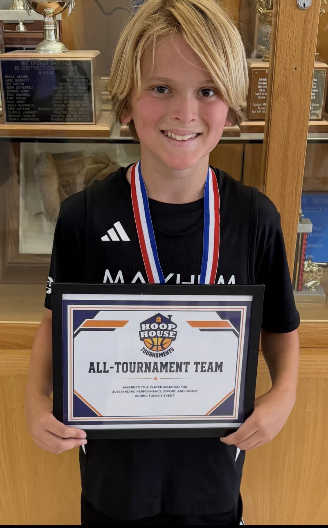 Mayhem player with his Hoop House All-Tournament Team award
